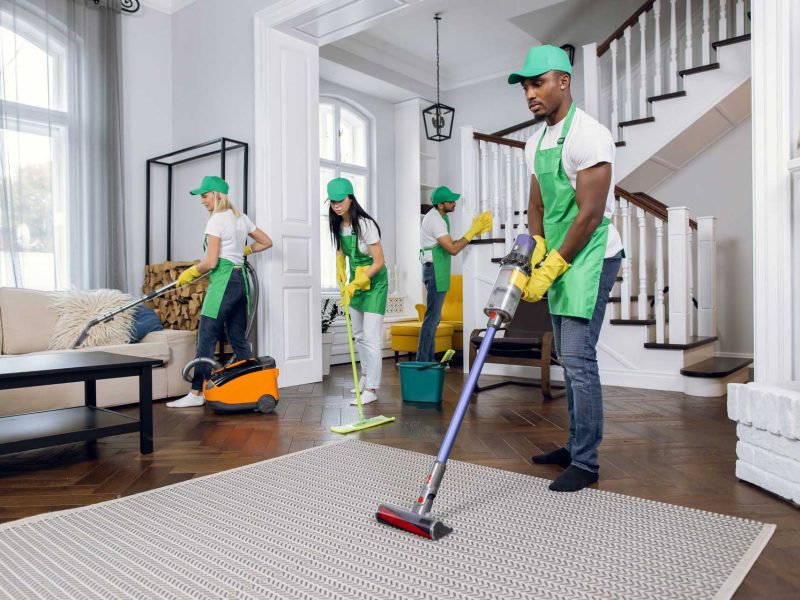 Group of four multiracial people cleaning client house